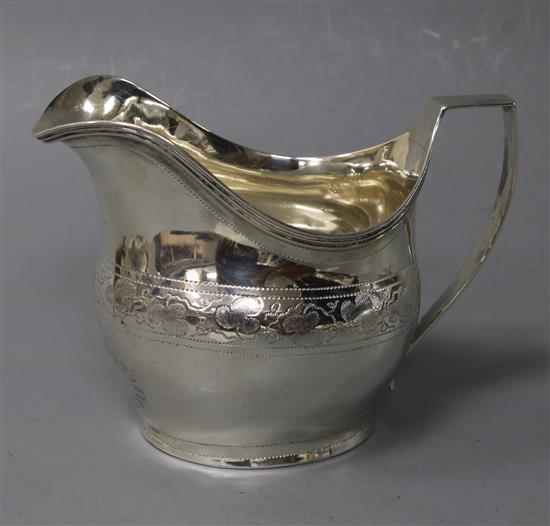 A George III silver helmet shaped cream jug, London, 1805, 88mm.